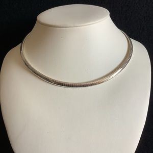 Silver tone omega necklace.new old stock.